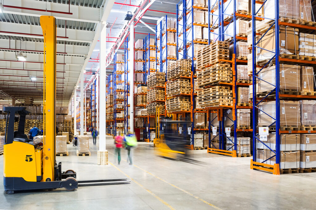 Interior of a modern warehouse with staff