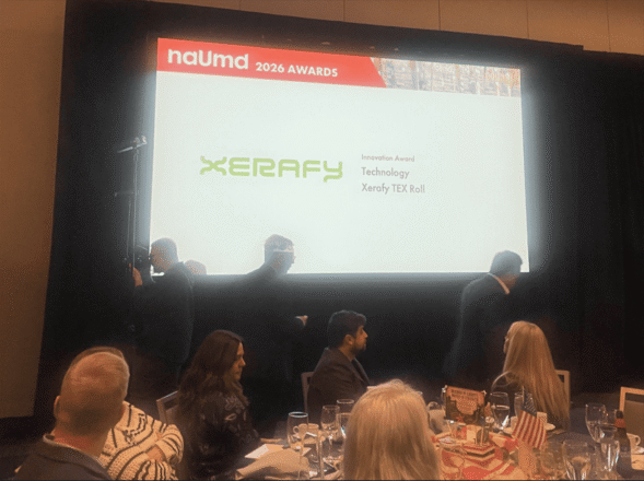 NAUMD-Award-2-589x440 Xerafy Wins NAUMD Innovation Award for TEX Roll, Introducing Print-Ready RAIN RFID Tagging for Uniform Manufacturing